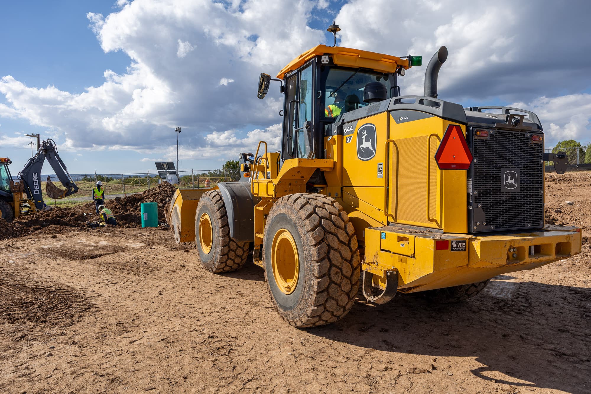 Wheel loader on a freshly graded pad under a big sky