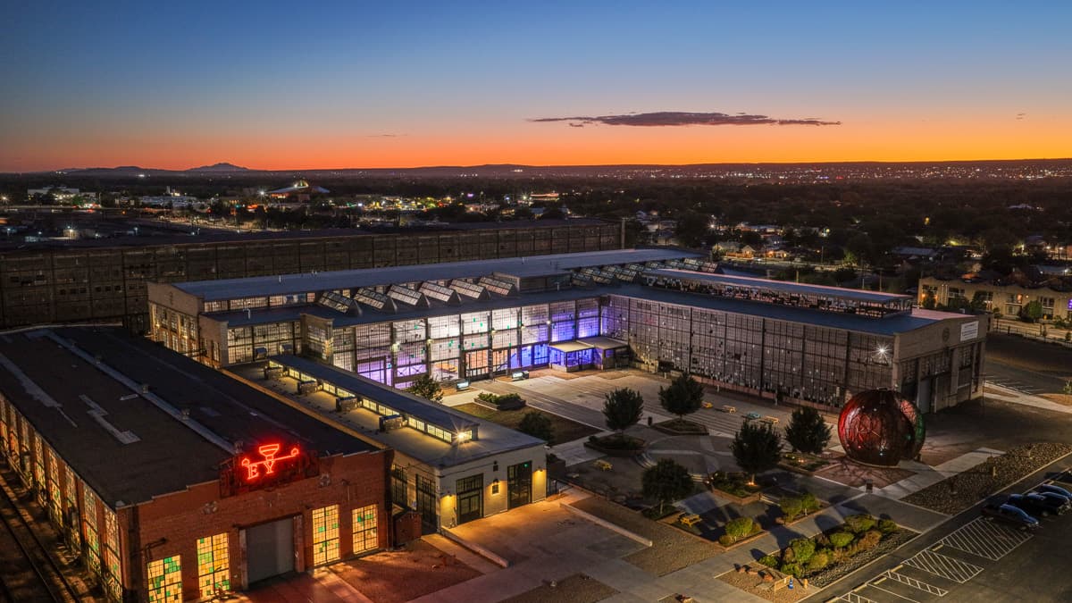 Aerial of the Railyards at sunset, the film school glowing purple